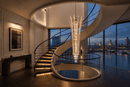 Plaza Crown Column Crystal Chandelier above a luxury spiral staircase in a London penthouse interior