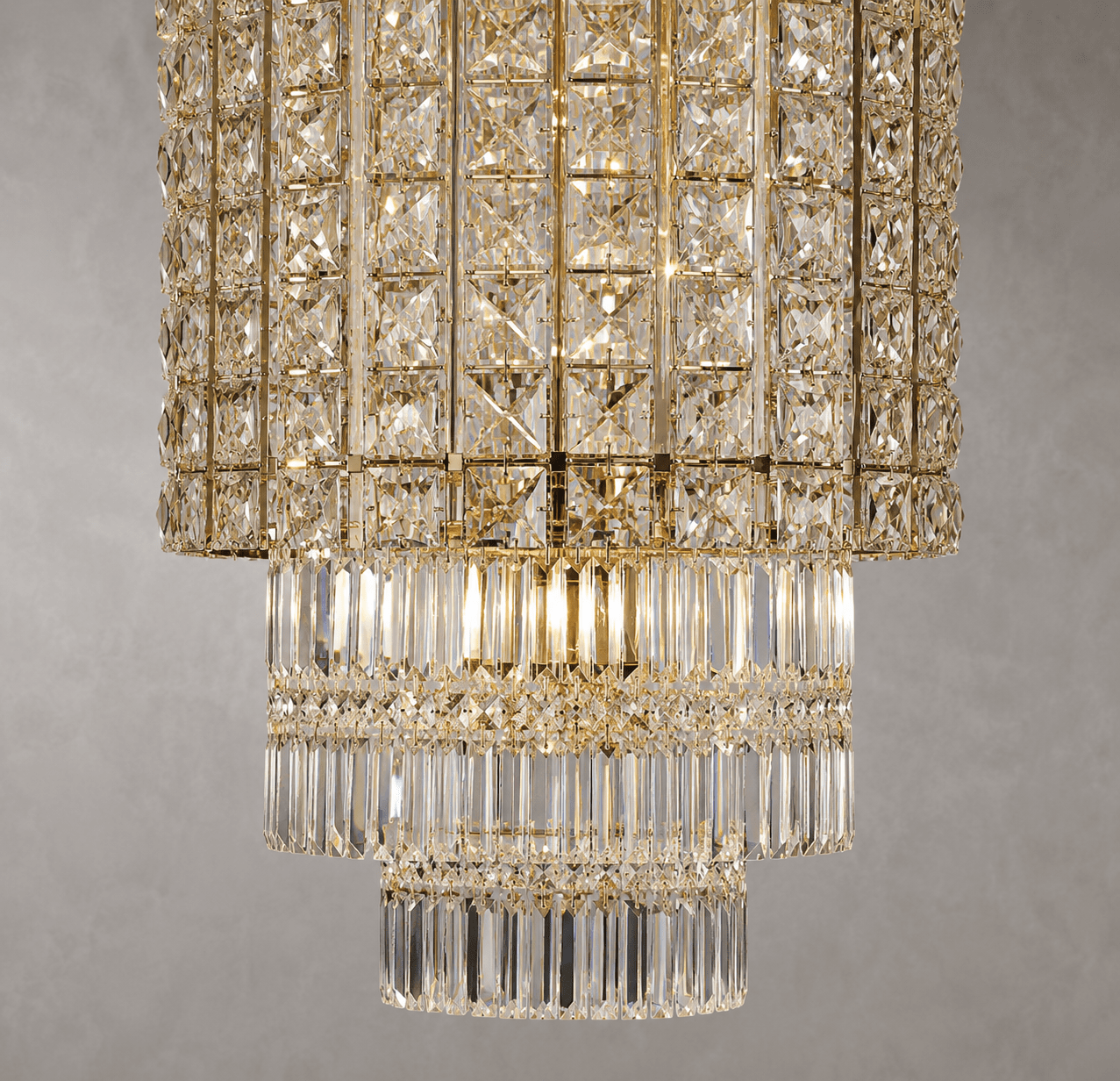 Close-up of the Plaza Crown Crystal Chandelier with tiered crystal prisms and luxury gold-plated finish