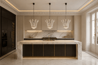 Three Plaza Crown Crystal Pendant lights above a luxury marble kitchen island in a modern Paris residence