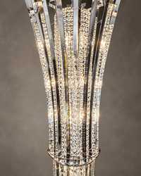 Close-up of Plaza Crown Prism chandelier showing tiered crystal pendants, chrome support rings and faceted crystal blades.