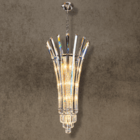 Plaza Crown Prism tall column crystal chandelier with solid crystal blades and chrome frame, front view.