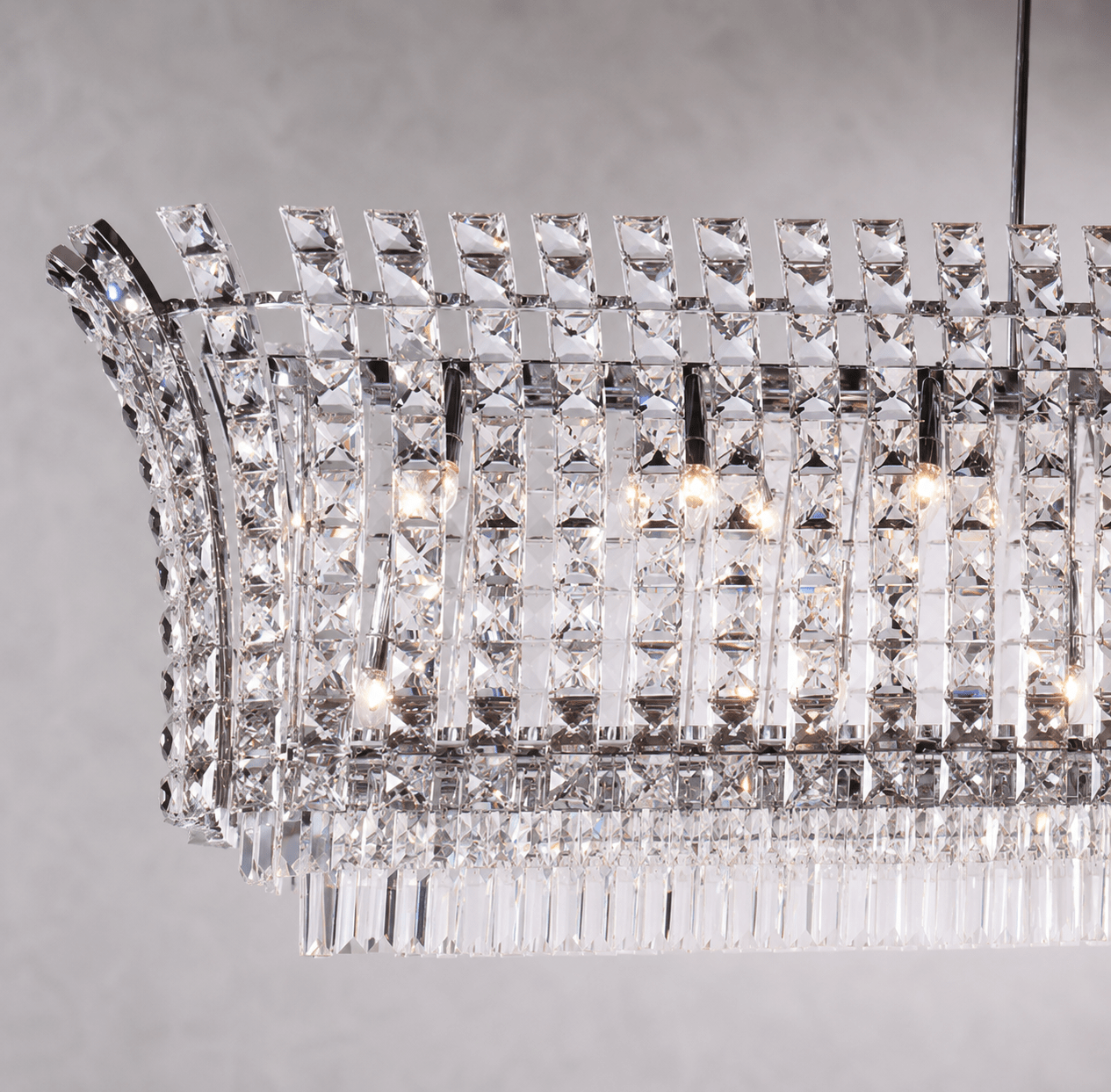 Close-up of Plaza Crystal Linear Grande Chandelier with premium crystal detailing and polished chrome finish