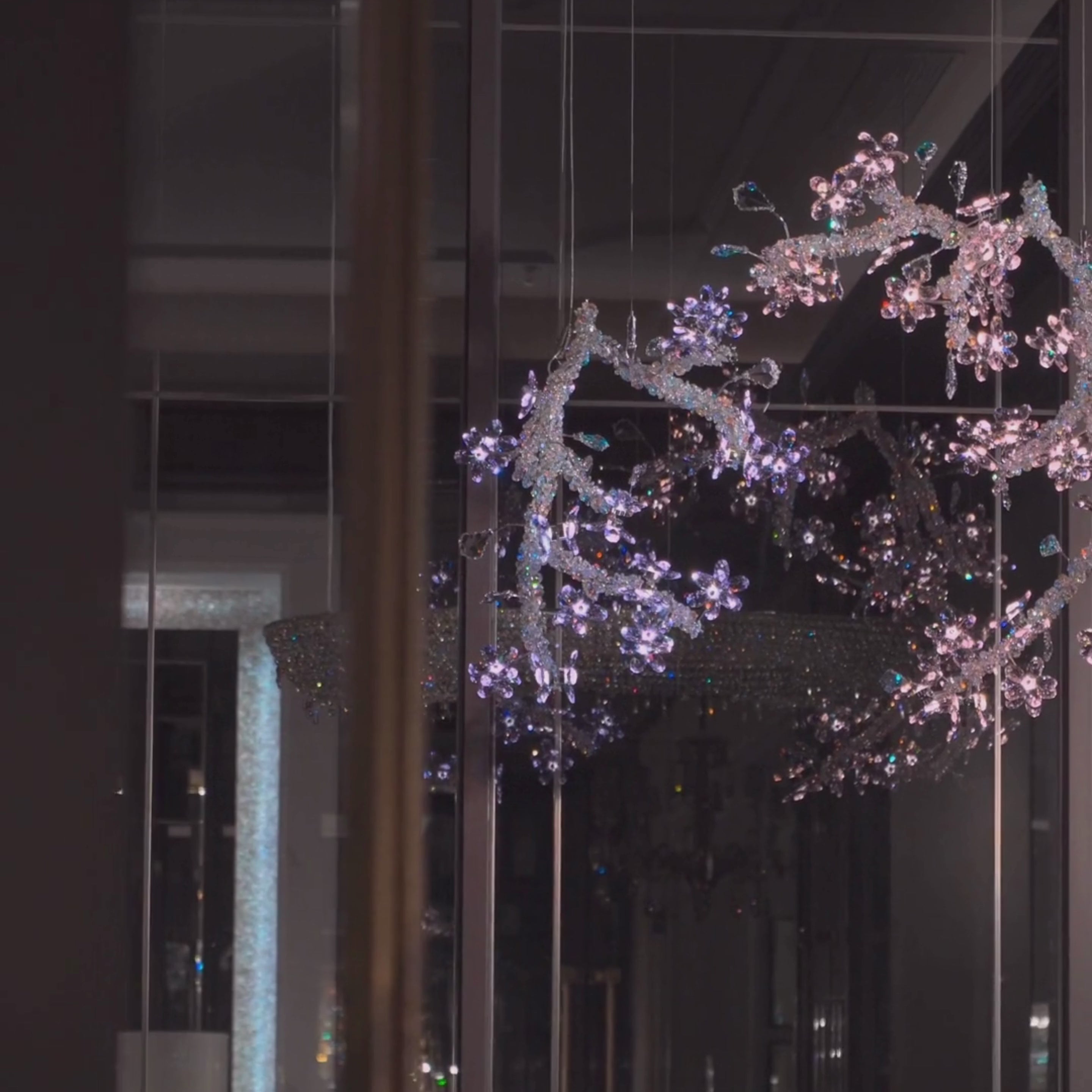 Flora Lumina crystal blossom pendant illuminated in interior space showing sparkling floral crystal branches