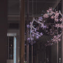 Flora Lumina crystal blossom pendant illuminated in interior space showing sparkling floral crystal branches