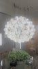 A short video of Alabaster chandelier installed above dining table with suspended sphere composition.