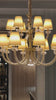 Video of the Maria Grandeur 15-light chandelier with ivory shades and crystal-wrapped arms showcased on a modern interior.
