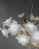 Video preview of Magnolia Grazia chandelier showing floating magnolia blooms and gold accents.