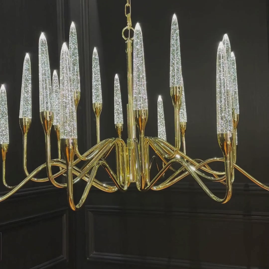 Video preview of the Luce di Roma Hestia chandelier showing rotating view of gold-plated arms and champagne crystal spires in motion.