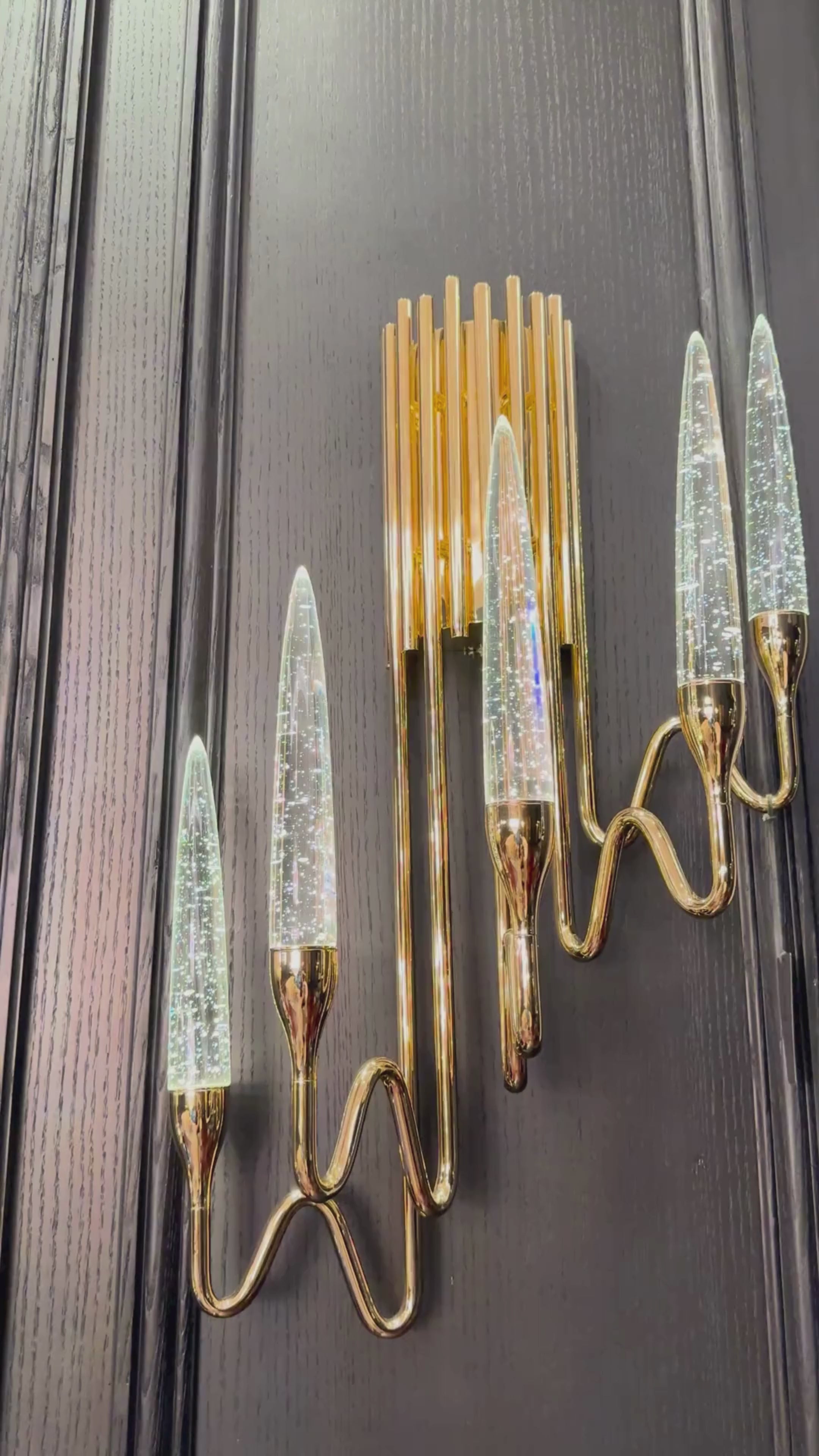 Video showcasing the Luce di Roma Foro wall sconce with 18K gold-plated frame and champagne Asfour crystal, glowing in a luxury interior.