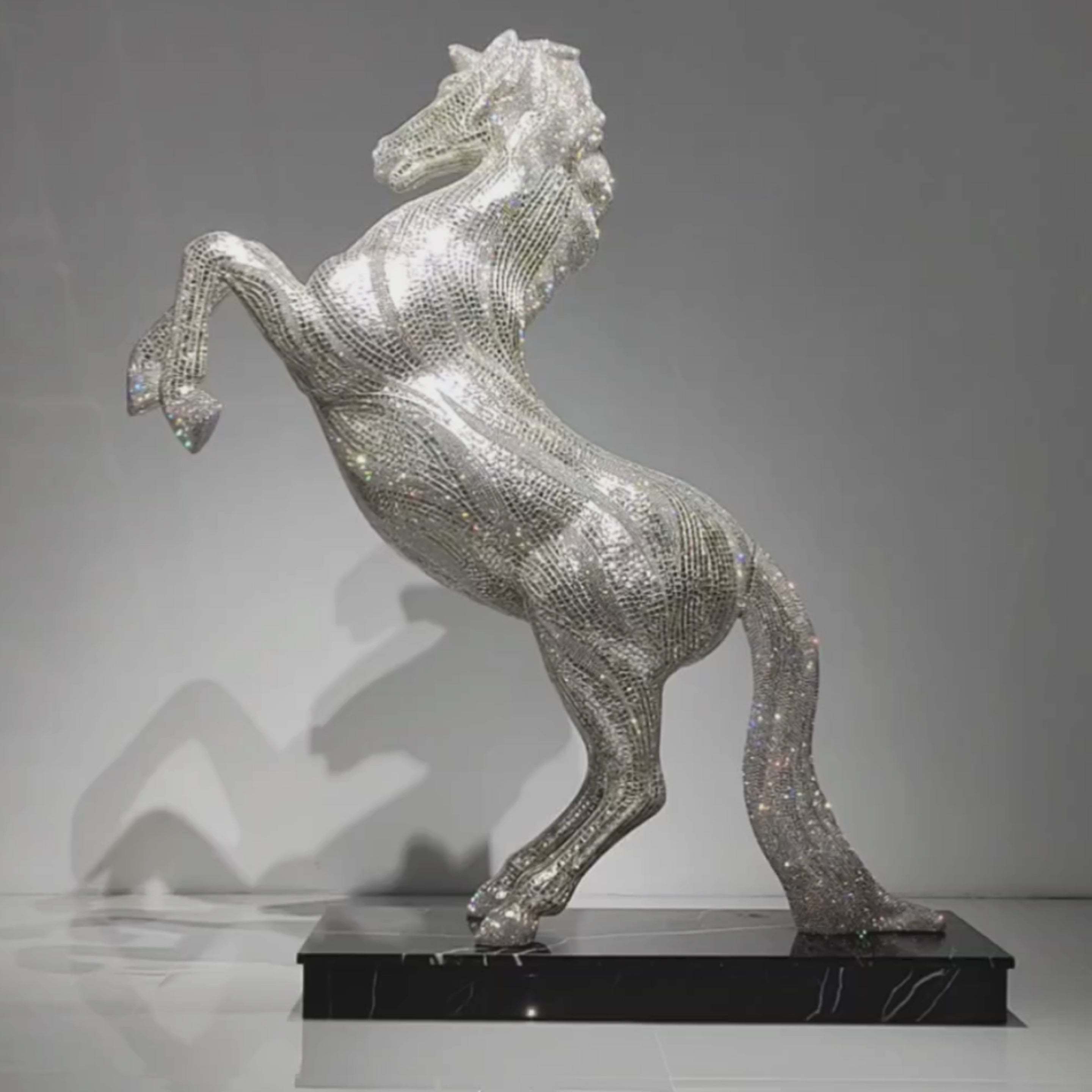 Video showing AZAR crystal stallion sculpture reflecting light across Swarovski crystal surface