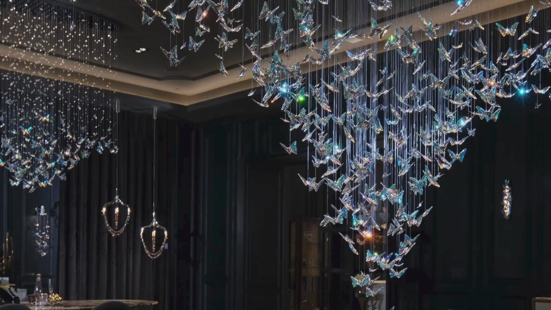 Papillon cascading crystal butterflies with seven electroplated multi-shade wings shifting tone under daylight and LED lighting.