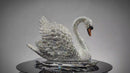 Video showing rotating VAGHAAR Swarovski crystal swan sculpture on crystal tray base.