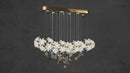 Video preview of Magnolia Grazia chandelier showing floating magnolia blooms and gold accents.