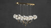 Video preview of Magnolia Grazia chandelier showing floating magnolia blooms and gold accents.