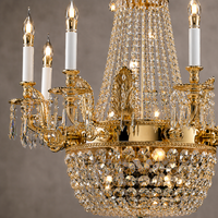Close-up of Regency Majestic chandelier showing 18K gold-plated copper, candle lights and Asfour crystal