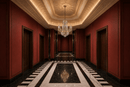 Regency Noble gold crystal chandelier in a luxury red-panelled entrance hall with marble flooring.