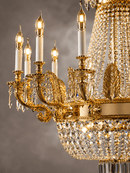 Close-up of Regency Sovereign chandelier in 18K gold-plated copper with Asfour crystal and candle lights