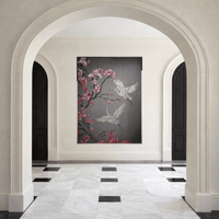 Large Swarovski crystal wall art Sakura displayed in luxury foyer interior with marble floor.