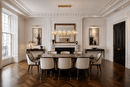 Solaris Cometa linear crystal chandelier in a luxury dining room with wood floor and decorative items Chelsea London