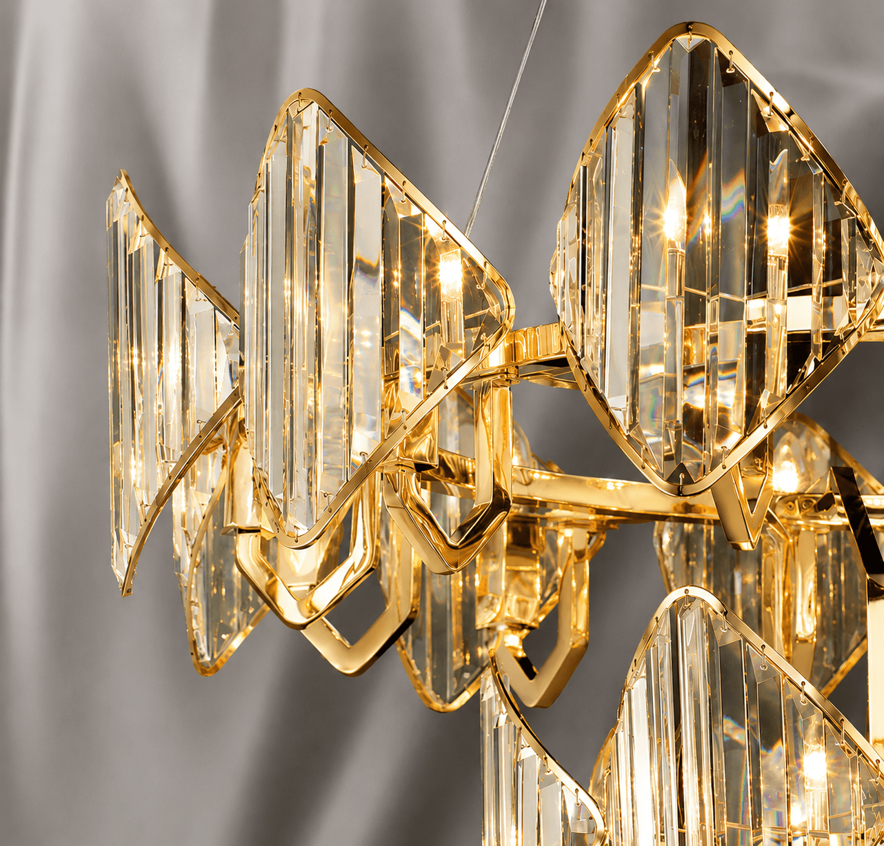 Solaris Iris luxury crystal chandelier close-up with 18K gold frame and precision-cut clear crystal panels