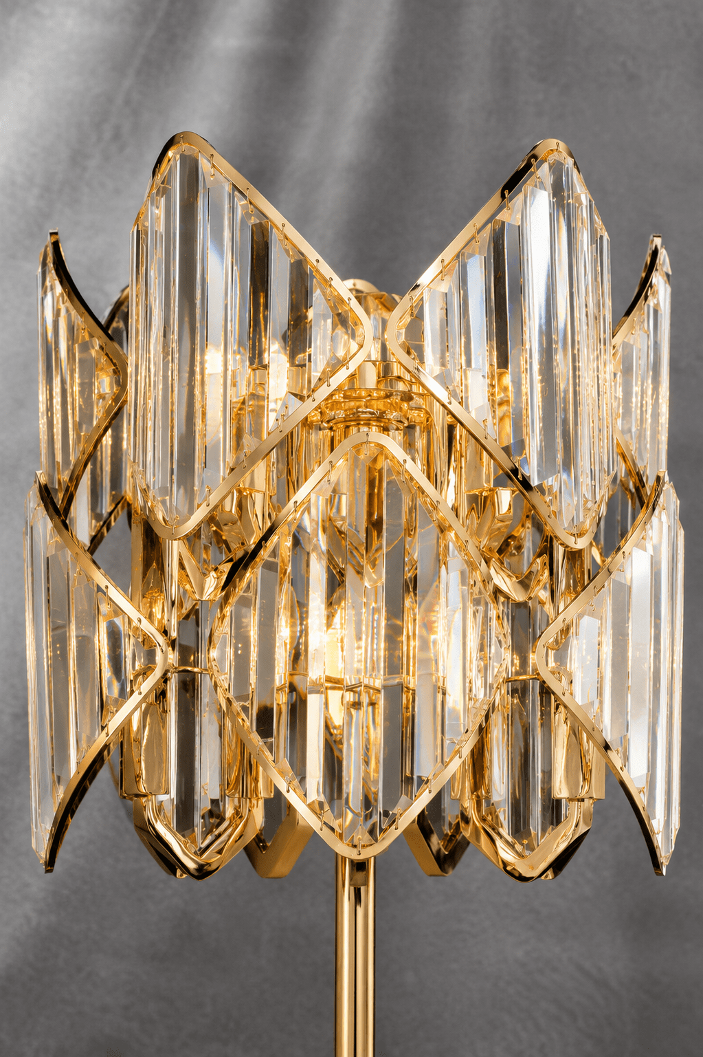 Close-up of Solaris Lyra crystal table lamp with polished gold finish and precision-cut crystal details