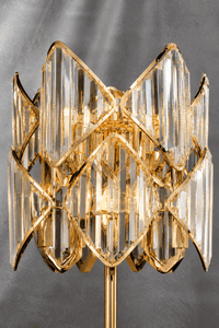 Close-up of Solaris Lyra crystal table lamp with polished gold finish and precision-cut crystal details