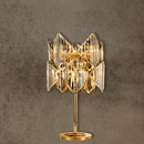 Solaris Lyra luxury crystal table lamp in 18K gold-plated copper with precision-cut prisms, front view.