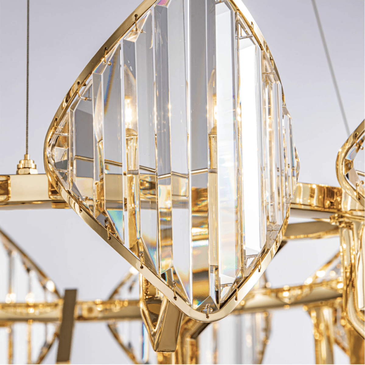 Close-up of Solaris Mitra precision-cut lead-free crystal with gold-plated copper framework