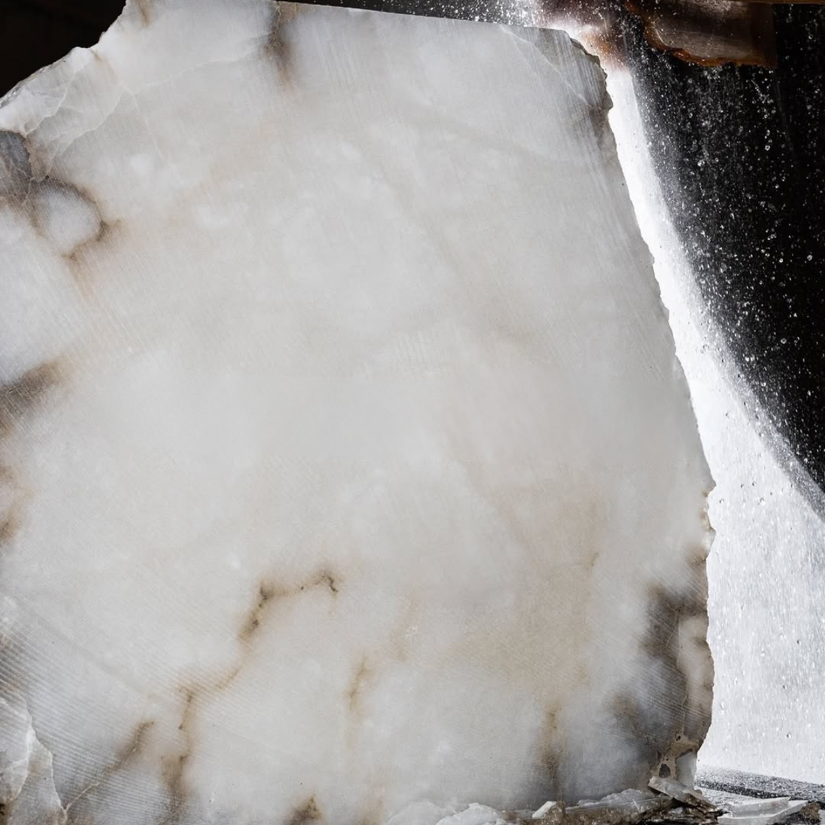 Raw Spanish alabaster stone slab showing natural translucency and veining used in luxury lighting.