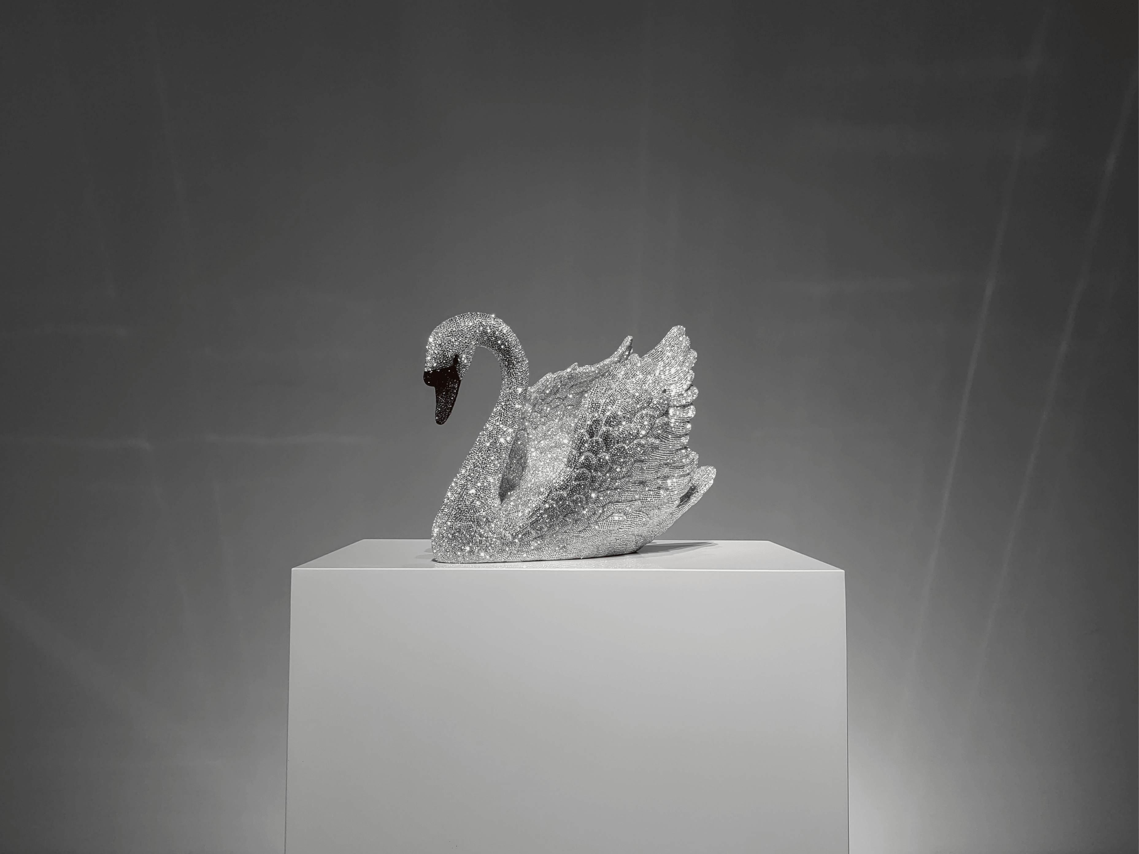Full view of VAGHAAR Swarovski crystal swan sculpture displayed as luxury centrepiece object.