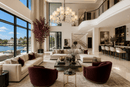 Varella chandelier installed in double-height living room, defining space with architectural lighting