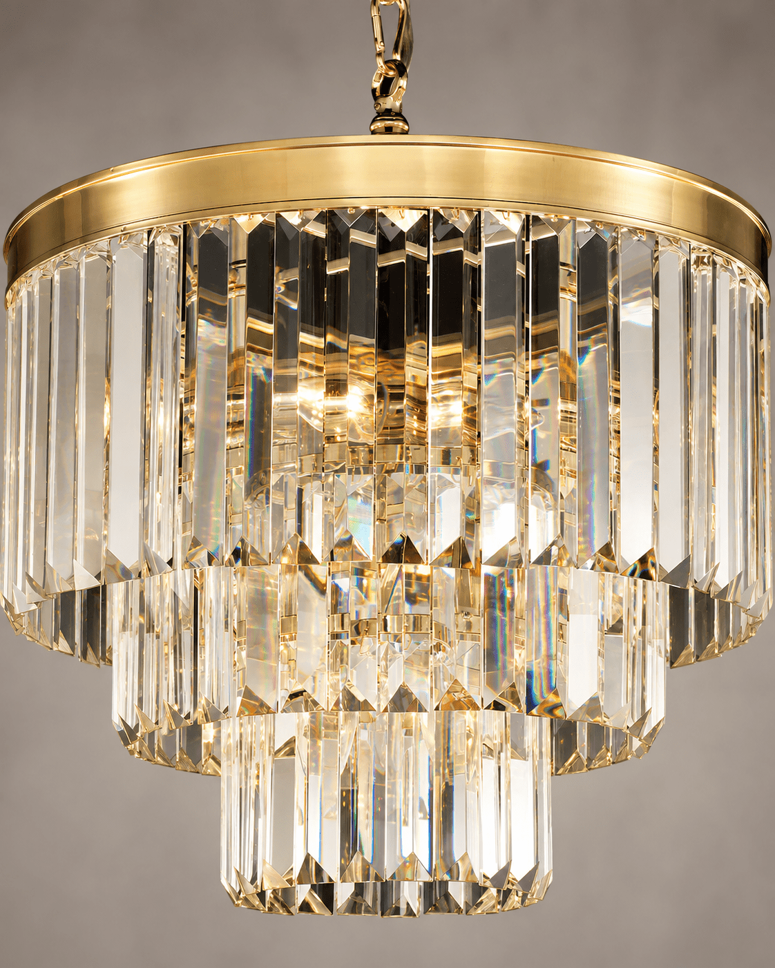 Close-up of Vendôme Bijou crystal chandelier with faceted prisms and warm 18K gold-plated frame.