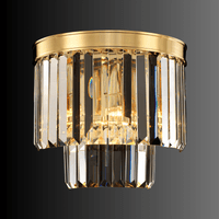 Angled view of the Vendôme Boutique wall sconce with 18K gold frame and Asfour crystals, designed for luxury modern interior.