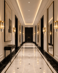 Vendôme Boutique crystal wall sconces installed in a luxury French hotel corridor with marble flooring and gold accents