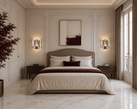 Luxury French-style bedroom featuring Vendôme Boutique crystal wall sconces, white marble flooring, and burgundy accents.