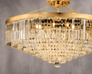 Close up shot of the crystal and copper parts of the Vendôme Grandeur chandelier by HDLS Lighting with grey background.