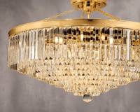 Close up shot of the crystal and copper parts of the Vendôme Grandeur chandelier by HDLS Lighting with grey background.