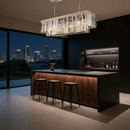 Vendôme Prestige crystal chandelier installed above a modern kitchen island with city views, adding refined sparkle to contemporary interiors.
