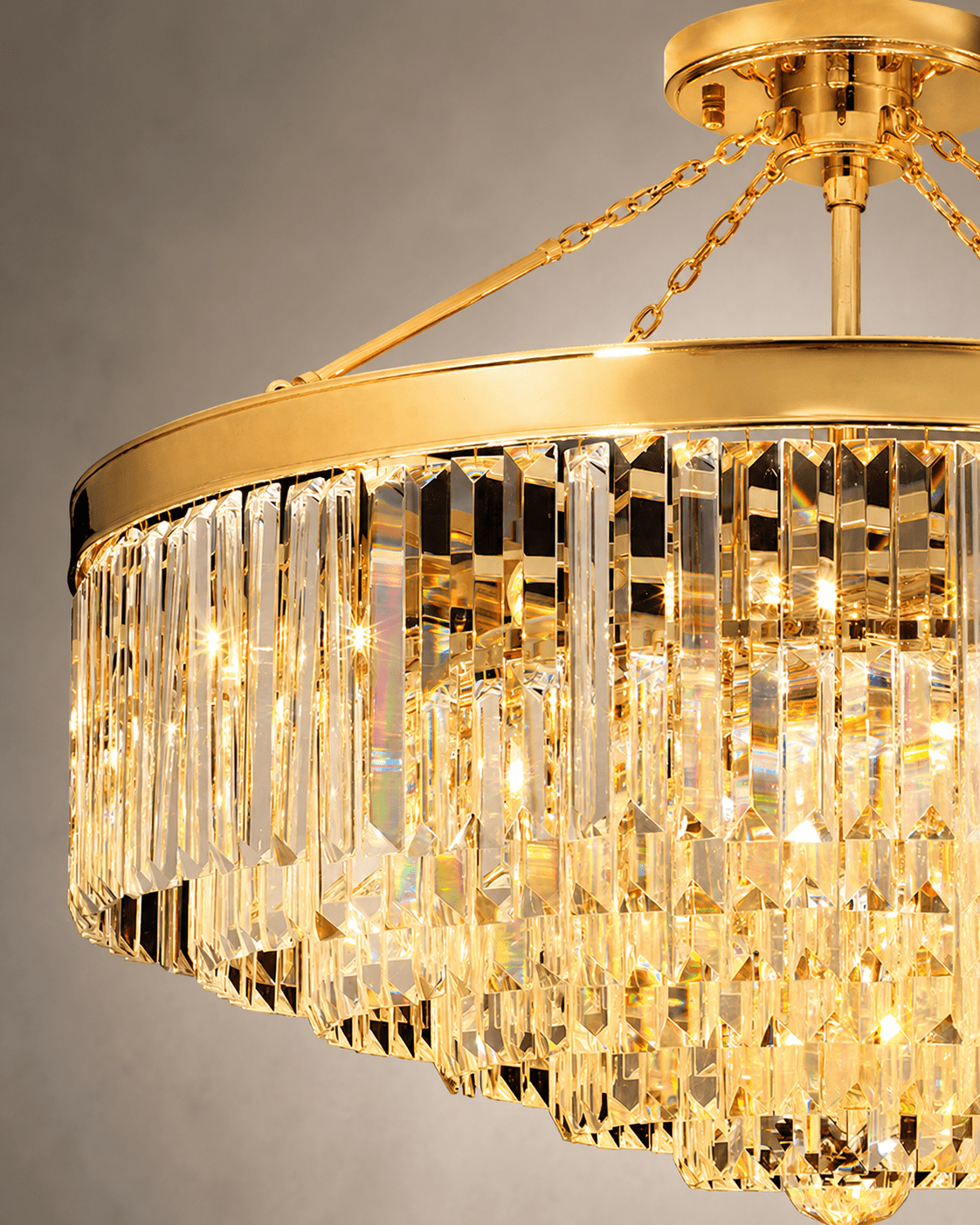 Close up shot of the crystal and gold parts of the Vendôme Royale modern crystal chandelier.