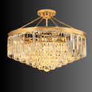 Angled view of the Vendome Royale 18K gold semi-flush crystal chandelier with tiered Asfour prisms.