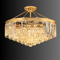 Angled view of the Vendome Royale 18K gold semi-flush crystal chandelier with tiered Asfour prisms.
