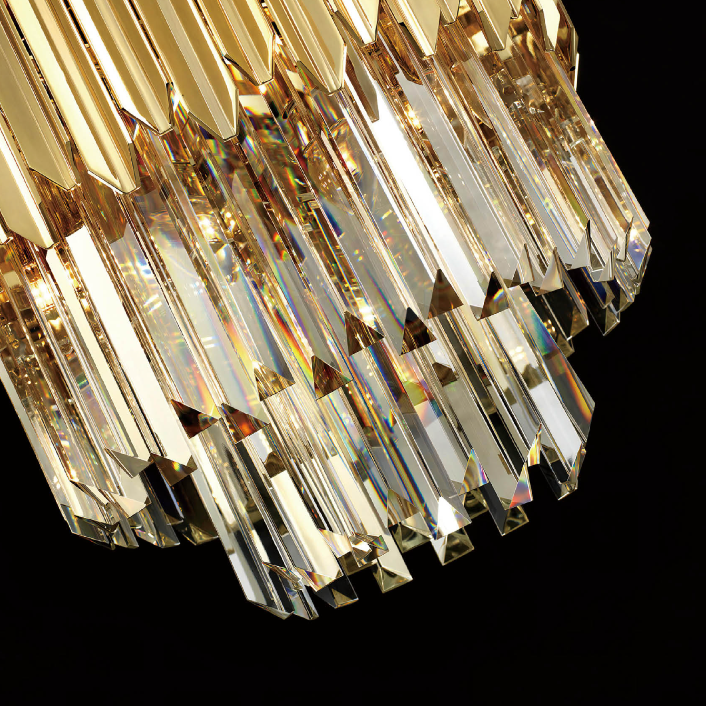 Close-up of precision-cut lead-free crystal and gold-plated stainless steel luxury pendant detailing.