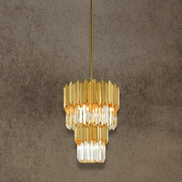 Luxury gold crystal pendant lighting in 24K gold-plated stainless steel for statement kitchen island design.