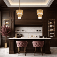 Luxury crystal kitchen island pendant lighting installed above marble island in high-end interior.