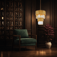 Luxury crystal pendant lighting installed in refined interior lounge with architectural wall detailing.