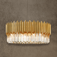 Zarrin Halo 24K gold-plated ring chandelier with crystal prisms, shown on textured architectural backdrop.