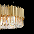 Close-up of Zarrin Luceris precision-cut crystal and gold elements creating layered prismatic reflections.