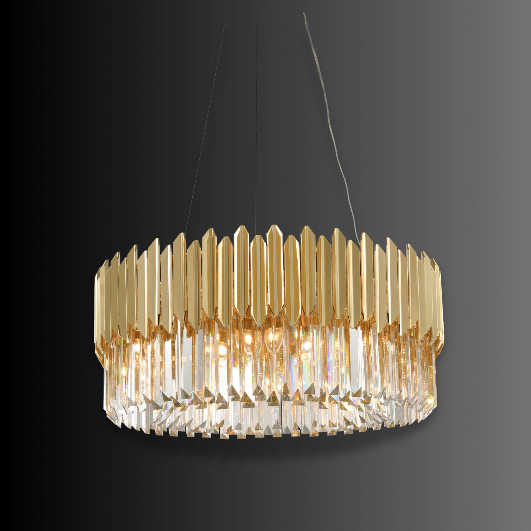 Zarrin Luceris architectural gold and crystal chandelier shown on dark background highlighting sculptural form.