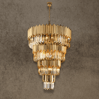 Grand four-tier crystal chandelier in gold finish designed for double-height foyer lighting