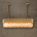 Zarrin Valeris linear crystal chandelier in 24K gold, designed for luxury dining tables and kitchen islands.
